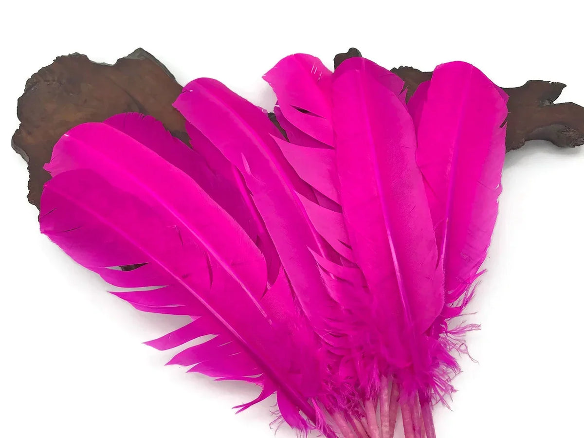 Vibrant bright pink dyed feathers for DIY crafts and fashion decor.