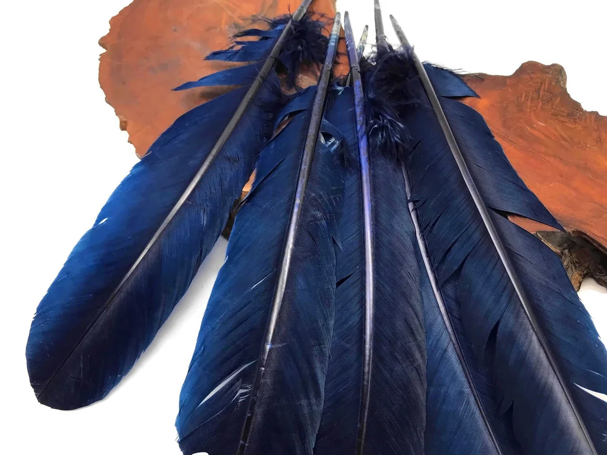 Deep blue dyed craft feathers for DIY fashion and décor accessories.