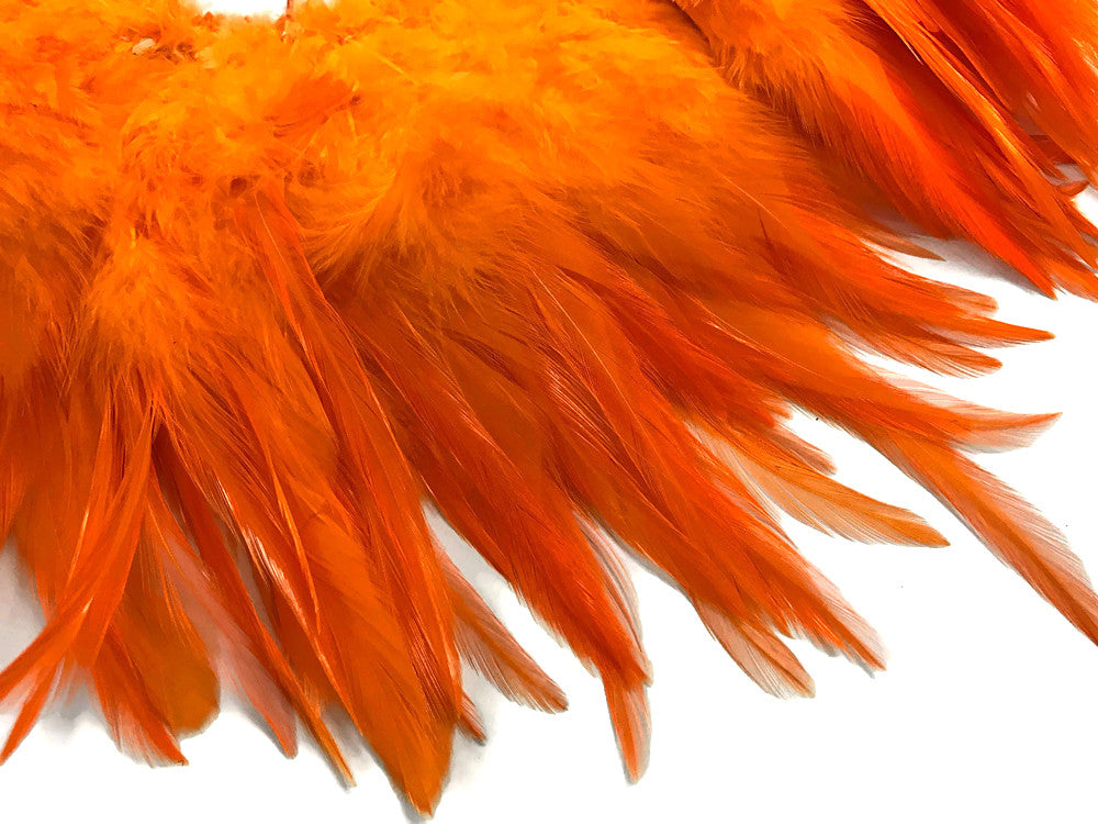 4 Inch Strip – 4-6” Dyed Orange Strung Chinese Rooster Saddle Feathers 