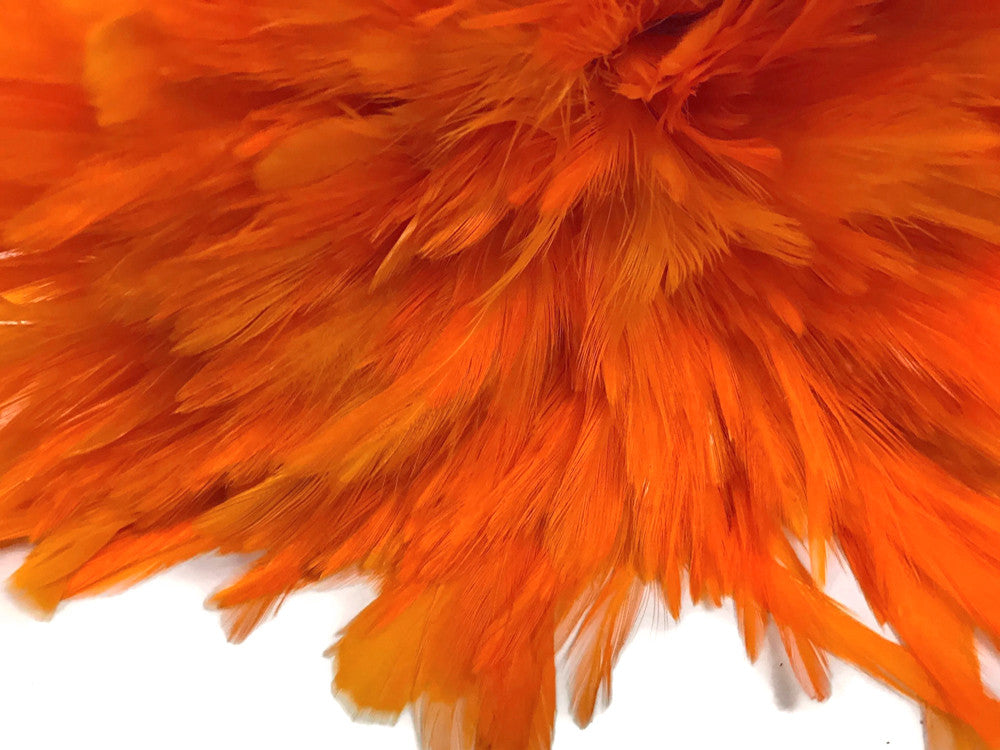 4 Inch Strip – 4-6” Dyed Orange Strung Chinese Rooster Saddle Feathers 