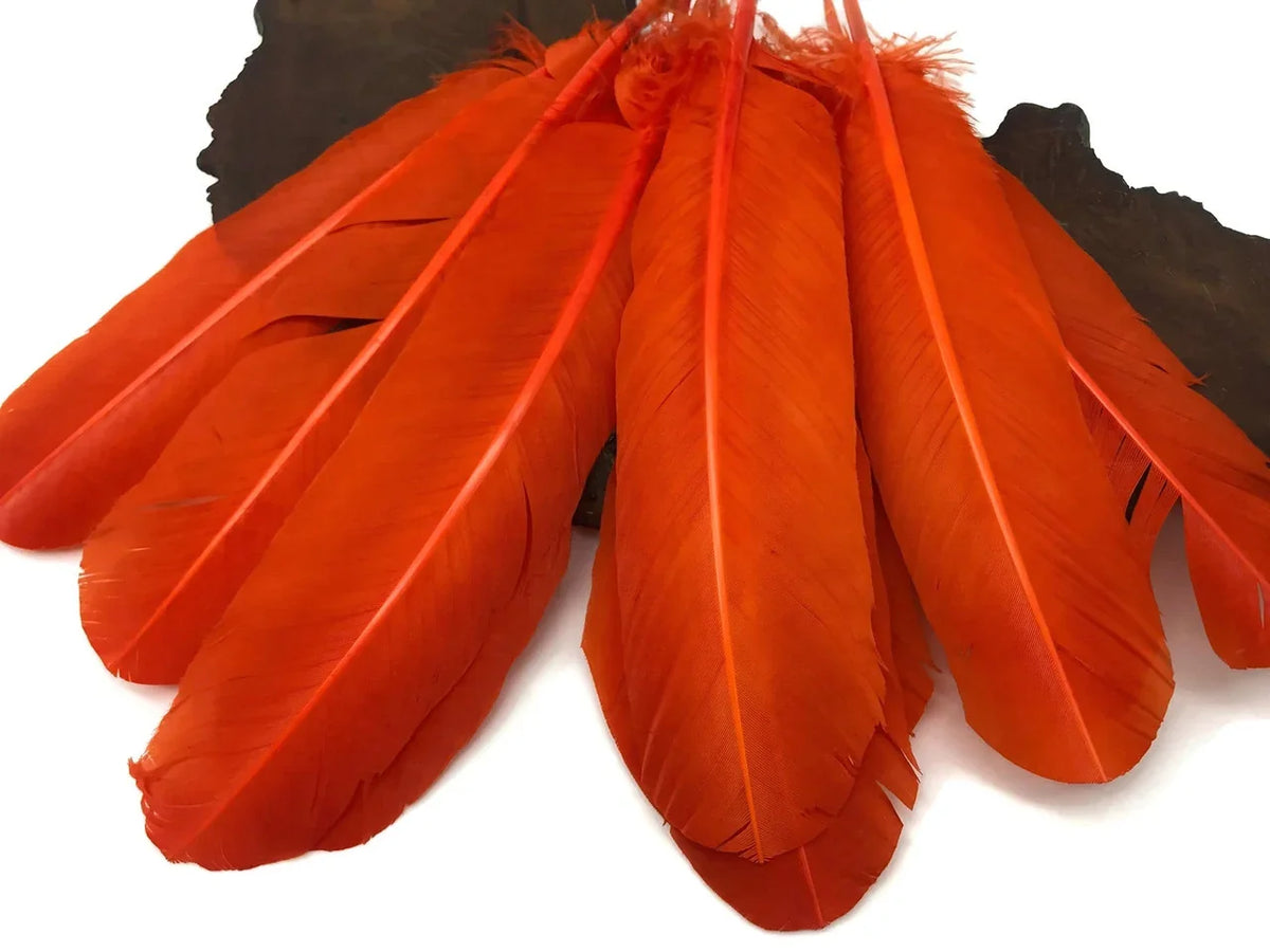 Vibrant orange craft feathers for DIY fashion and décor accessories.