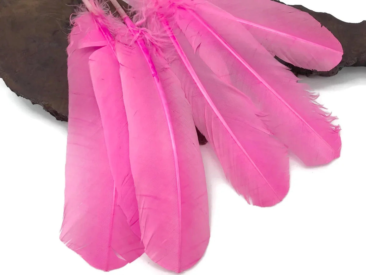 Vibrant pink dyed feathers for DIY crafts, fashion accessories, and creative décor.