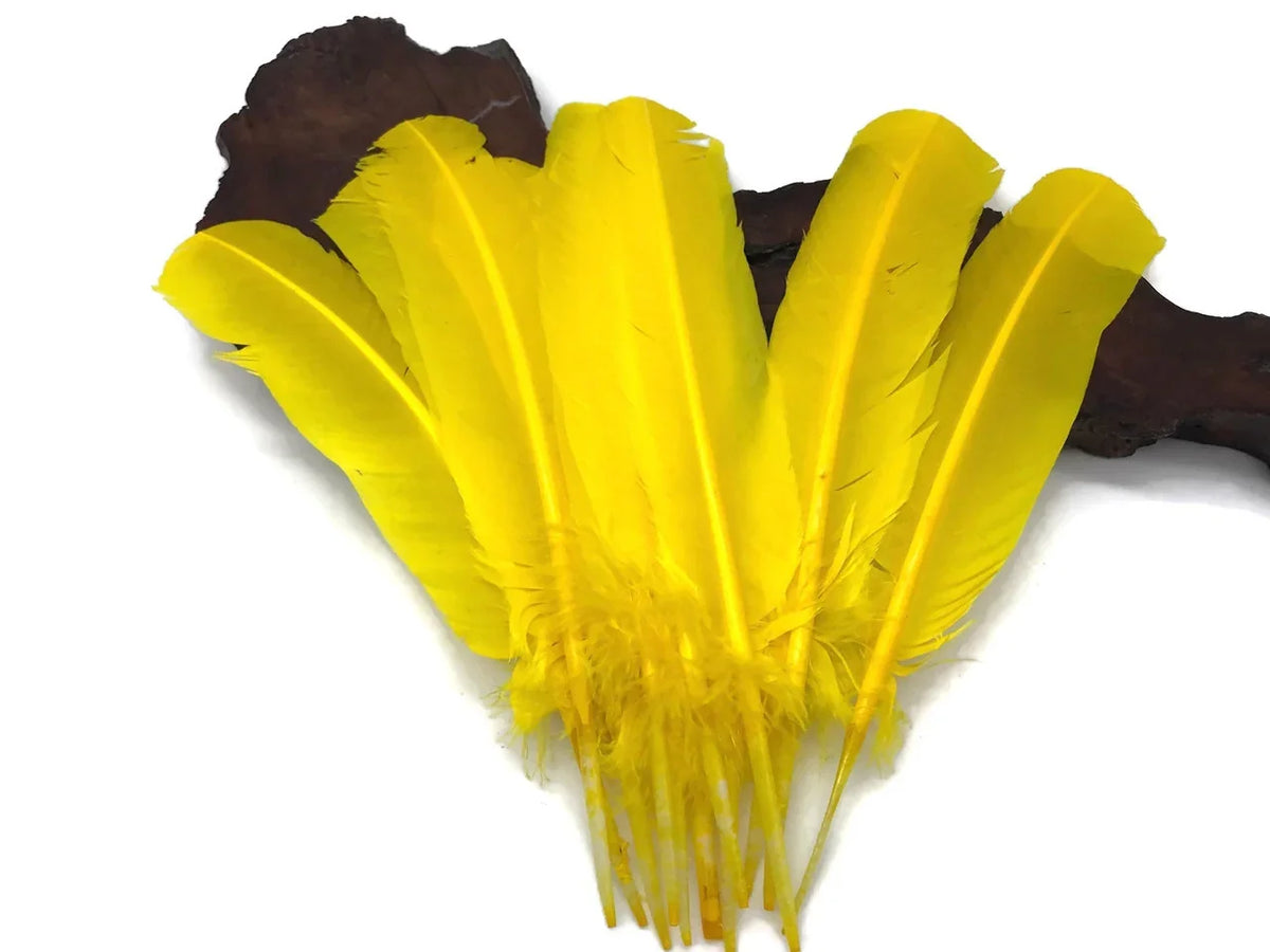 Vibrant bright yellow craft feathers for DIY fashion and decor projects.